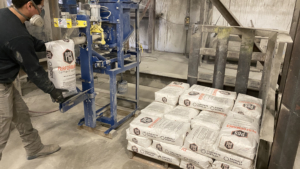 Man bagging PCS Cement Products